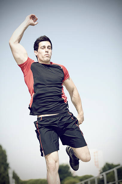 istock Athlete jumping at the park 488977193