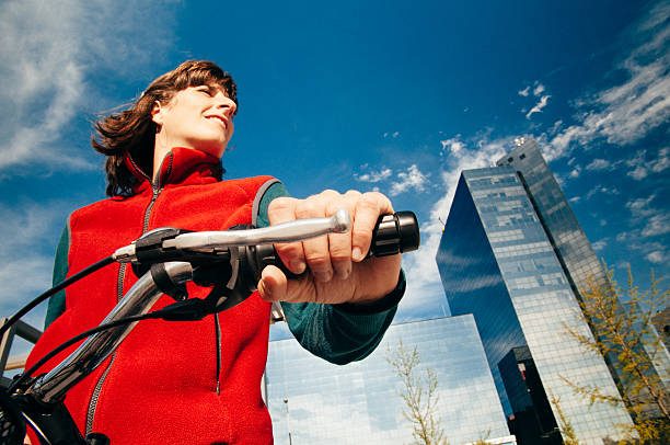 Woman commuting by bike in Barcelona. Spain.