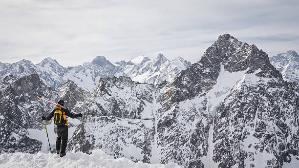 istock skier admiring the mountains 488978693
