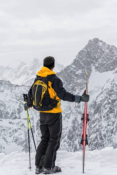 istock skier admiring the mountains 488978707