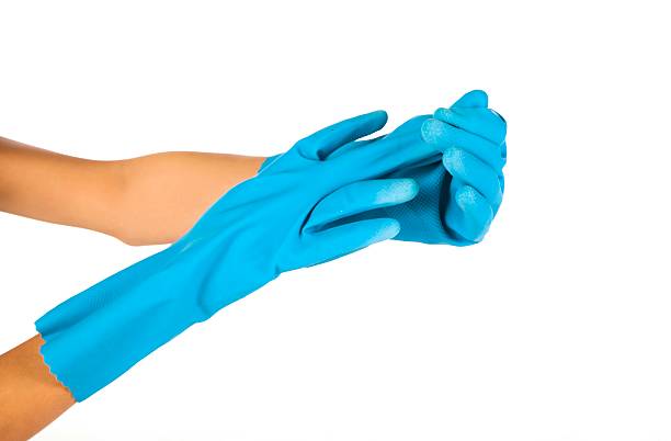 guantes de caucho azul sobre fondo blanco - nonconductor fotografías e imágenes de stock