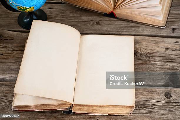 Open Old Book With Blank Pages With Globe Closeup Stock Photo - Download Image Now - Globe - Navigational Equipment, History, Textbook