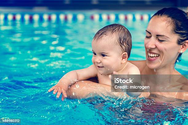 Baby Boy With His Mother In The Pool Stock Photo - Download Image Now - Baby - Human Age, Swimming Pool, Swimming