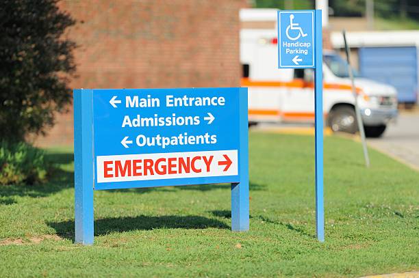 Hospital entrance and emergency sign with ambulance stock photo