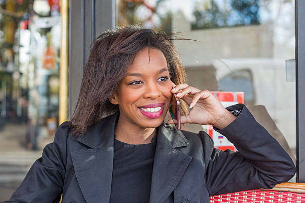 istock French Cafe Talking on the Phone African Woman 488983272