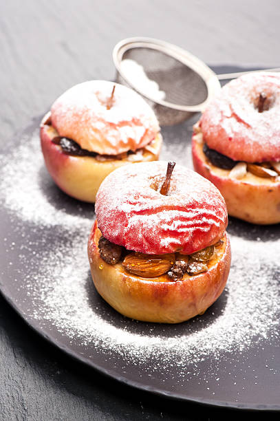 istock Baked apples stuffed with nuts and dried fruits 488983312