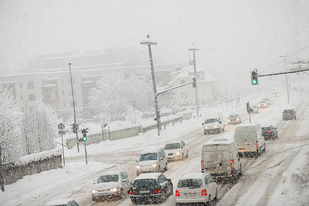 istock Urban traffic on the street in snowfall 488983734