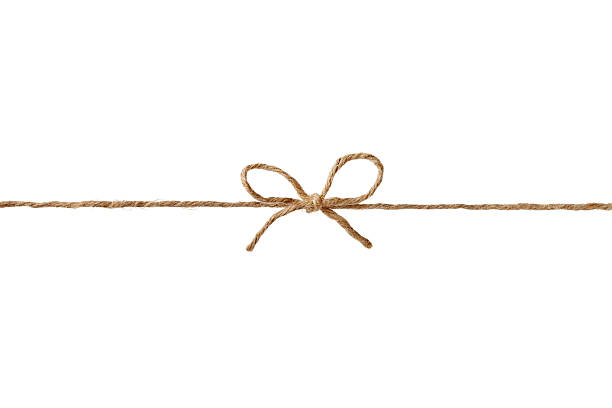 string or twine tied in bow isolated for your design Closeup string or twine tied in a bow isolated on white background string stock pictures, royalty-free photos & images