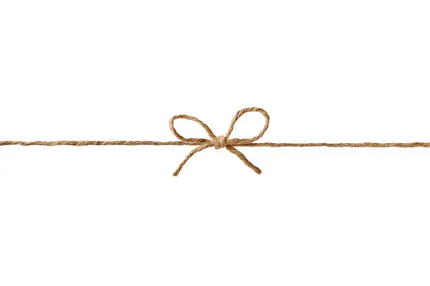 Photo of string or twine tied in bow isolated for your design