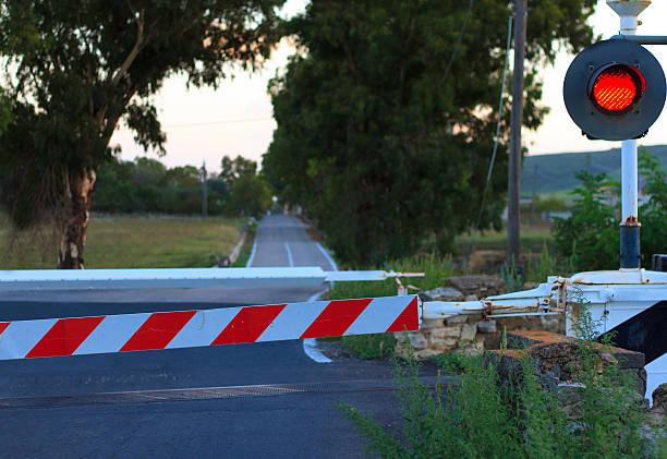 istock Stopped at Railway Crossing Gate on Country Lane, Europe 488986166
