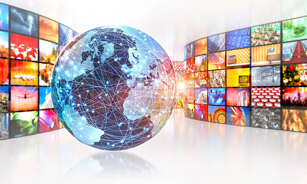istock Television broadcasting around the world surrounded by multimedia images 488988792