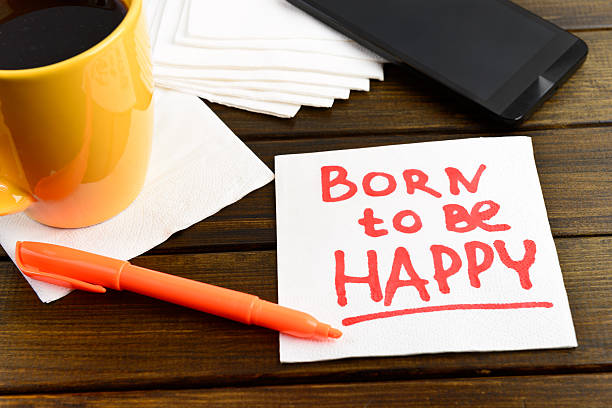 istock Born to be happy writing on white napkin 488990090