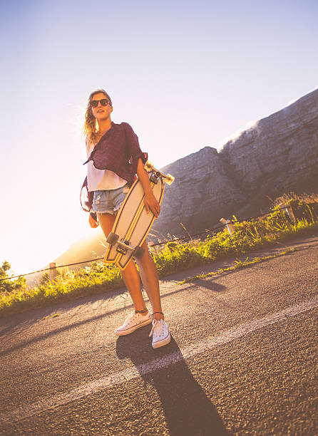 istock Skater girl with longboard 488997733