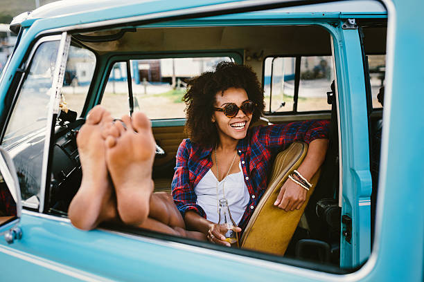 istock Girl barefoot in the car 488997751