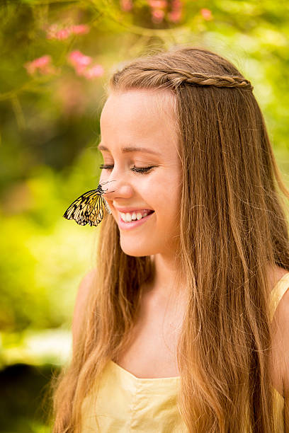 istock Butterfly on girls nose 488997815