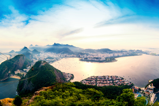 Panoramic view of Rio de Janeiro city with Christ the Redeemer at background. Photo taken above the sugarloaf mountain. The famous overhead cable car is in this photo.