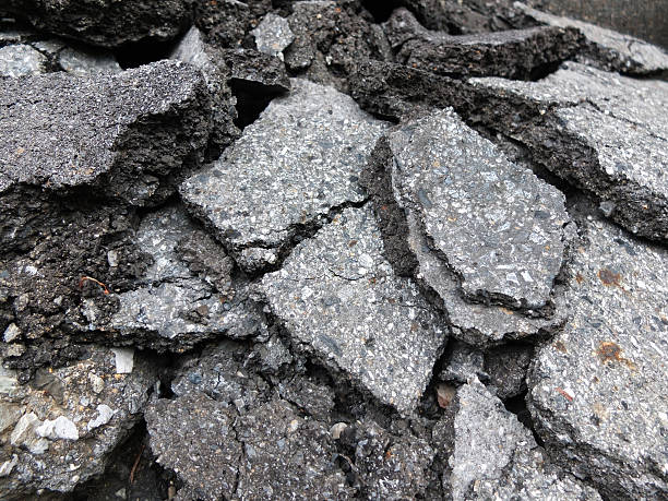 istock Pile of broken asphalt in the street surface 489000196