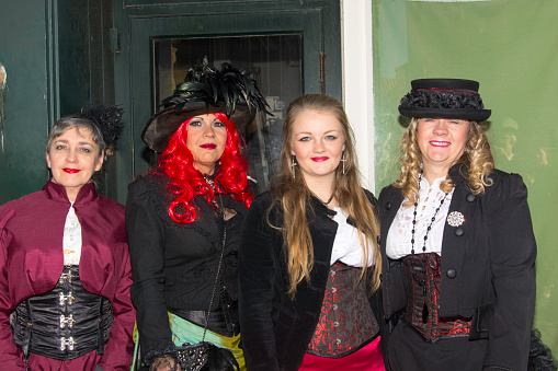 Whitby, UK - November 1, 2014: Whitby Goth Weekend, often abbreviated to WGW or simply referred to by attendees as Whitby, is a twice-yearly music festival for goths, in Whitby, North Yorkshire, England, organised by Jo Hampshire who runs Top Mum Promotions. Goths in full dress at St Mary's Church