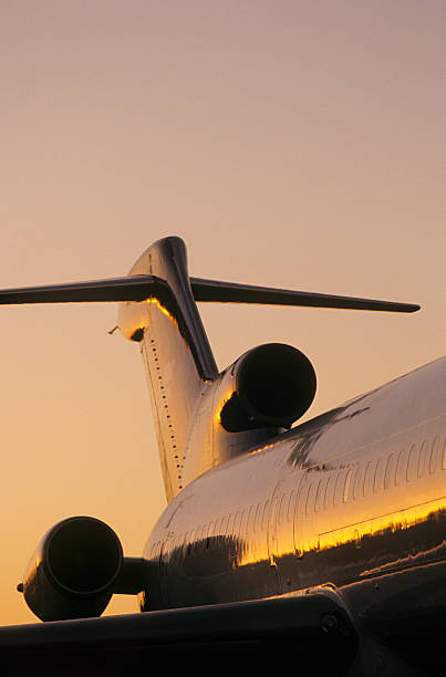istock Tail fin of airplane, sunse 489000459