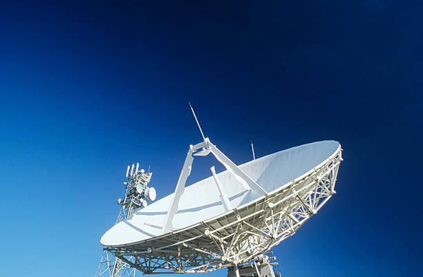 istock Telecommunications satellite dish and communications towers 489000491