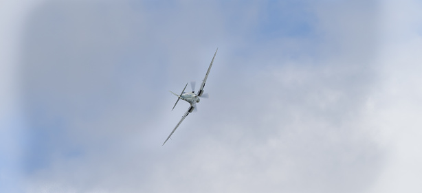 Yeovilton, UK - 11th July 2015: A vintage Spifire fighter in flight at Yeovilton Air Day.