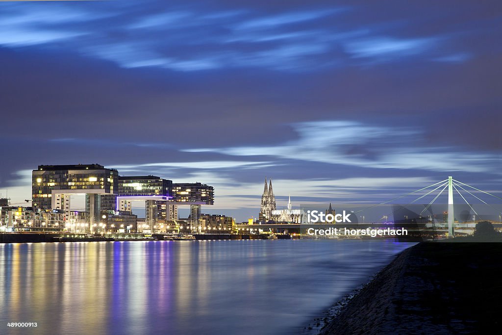 Cologne, Germany, Rheinau Harbor Cologne Cathedral with Severins-Bridge and the Rheinau Harbor at night Architecture Stock Photo