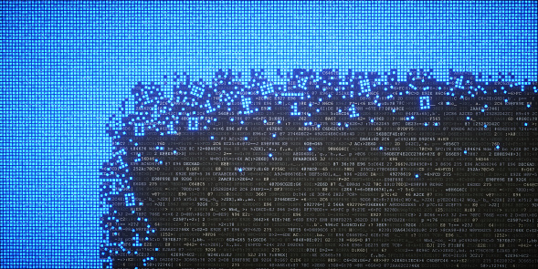Abstract IT concept image showing data blocks sitting on top of encrypted text. Pixelated blocks of binary data are compacted in an uniform mass across the left and top side of the image. Part of this structure is shown crumbled with binary digits being extracted, representing Data-mining in a literal sense of mining.