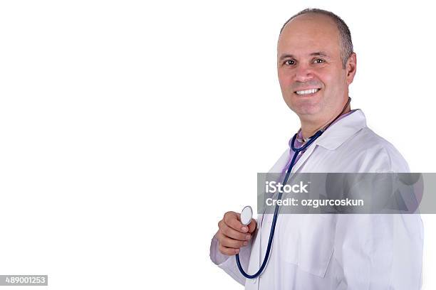Middle Aged Practitioner Doctor Looking At You Trustfully Stock Photo - Download Image Now