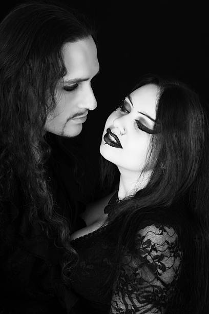 istock B&W of young Vampire couple face to face. 489002111