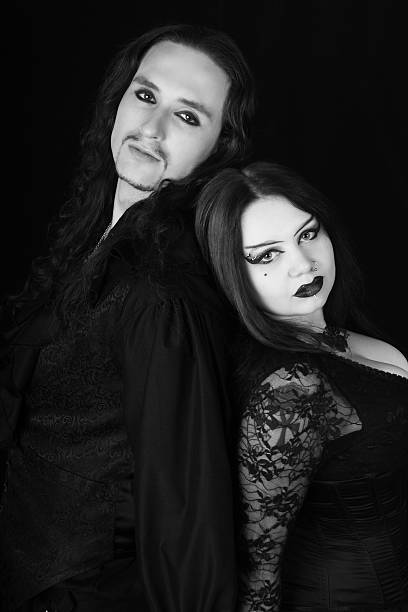 istock Young Goth couple back to back. 489002215