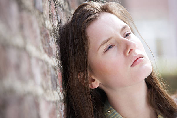 istock Young woman thinking outdoors 489004881