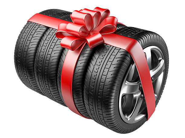 istock Gift set tyres with a wrapped red ribbon and bow. 489005042