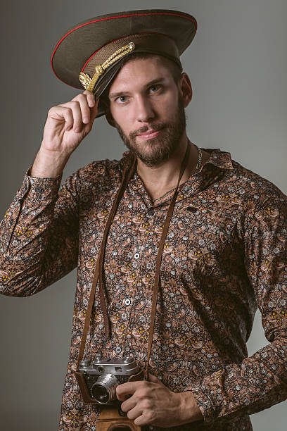 istock Russian Tourist Wearing Military Hat and Camera 489005876