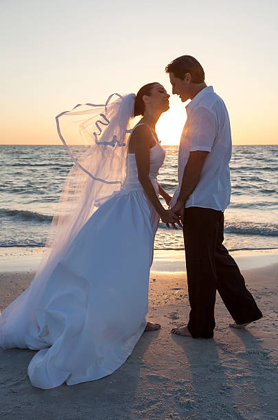 istock Bride and Groom Married Couple Sunset Beach Wedding 489006398
