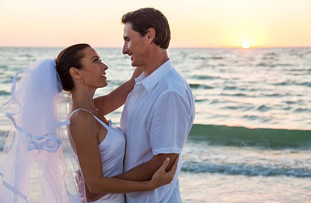 istock Bride and Groom Married Couple Sunset Beach Wedding 489007098