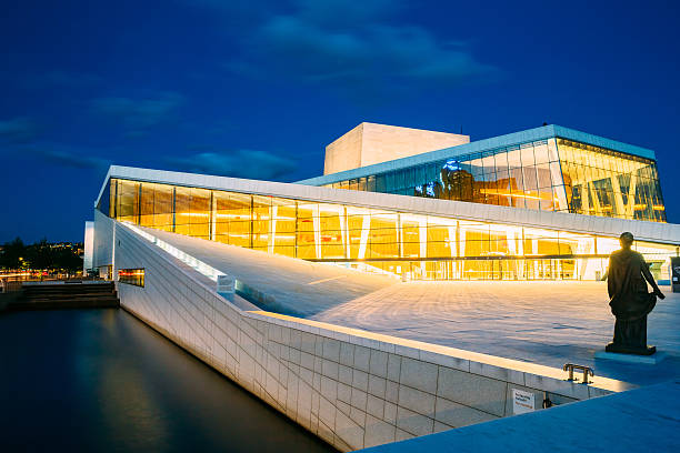 Exterior of White Building of The Oslo Opera House, Norway Oslo, Norway - July 31, 2014: Night View of White Building of The Oslo Opera House Is The Home Of The Norwegian National Opera And Ballet. Norway opera stock pictures, royalty-free photos & images