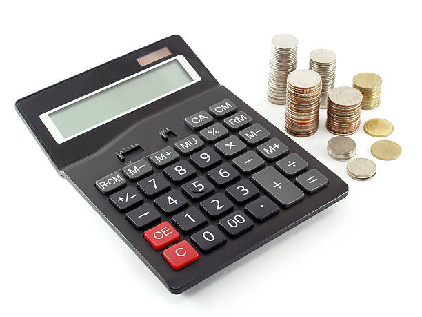 istock calculator and Coins on white background 489008072
