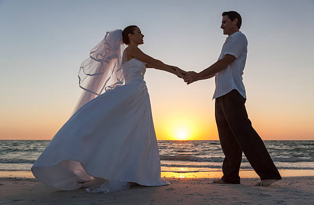 istock Bride and Groom Married Couple Sunset Beach Wedding 489008582