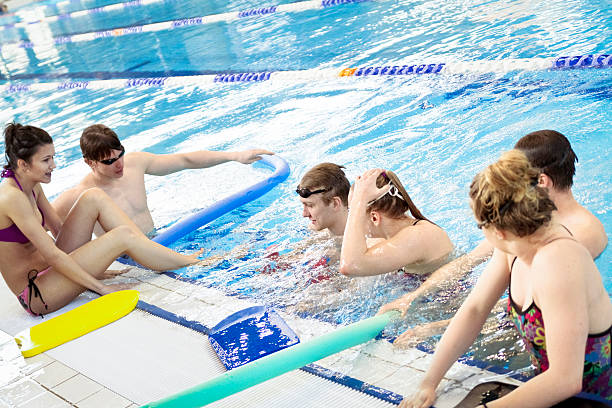 istock Group of friends in swimming pool 489010444