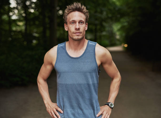 istock Athletic Man at the Park with Hands on Waist 489010664