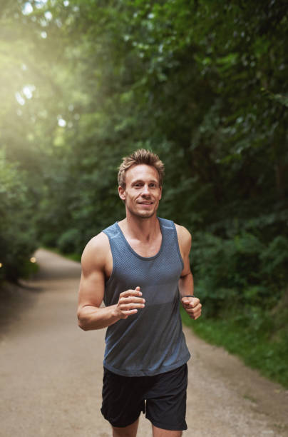 istock Athletic Man Running at the Park in the Morning 489010902