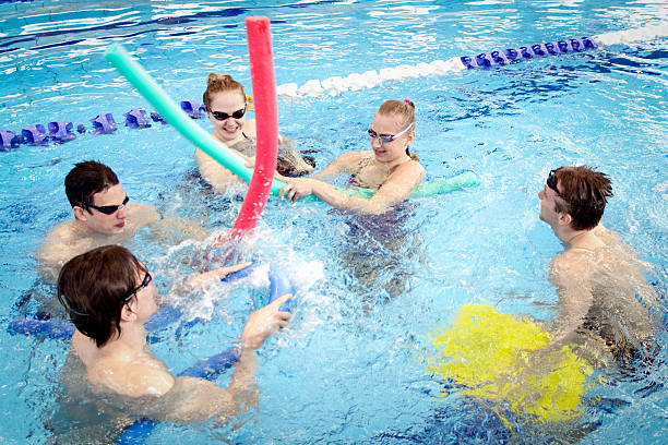 istock Group of friends in swimming pool 489010906