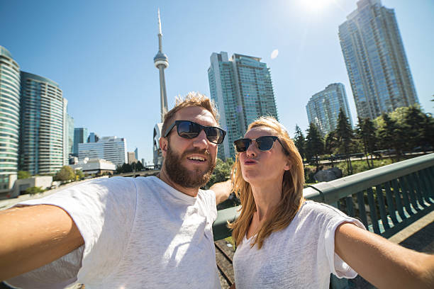 istock Two young adults taking a selfie portrait in Toronto 489012900