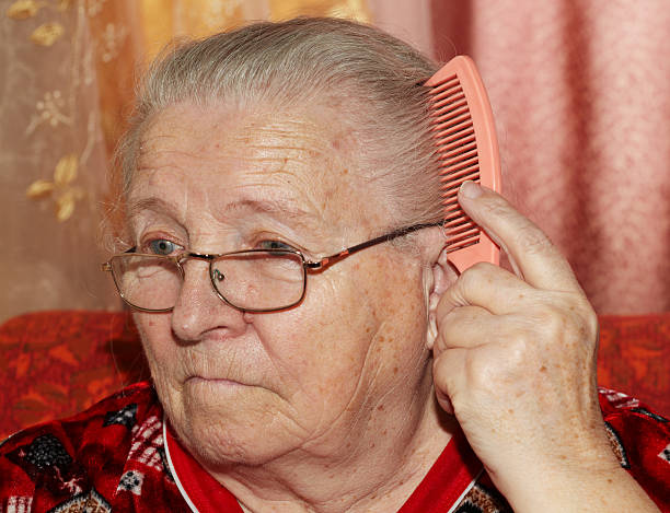 istock Elderly woman and comb 489014564