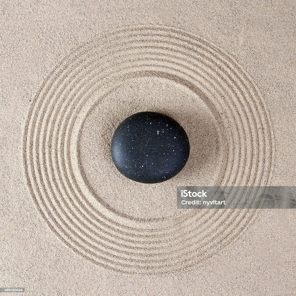 Stones Stones on raked sand Art Stock Photo