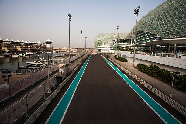 Yas Hotel the iconic symbol of Abu Dhabi's Grand Prix Abu Dhabi, UAE- May 13,2014: The Yas Hotel - the iconic symbol of Abu Dhabi's Grand Prix. It is the first new hotel in the world to be built over an F1 race circuit motor racing track photos stock pictures, royalty-free photos & images