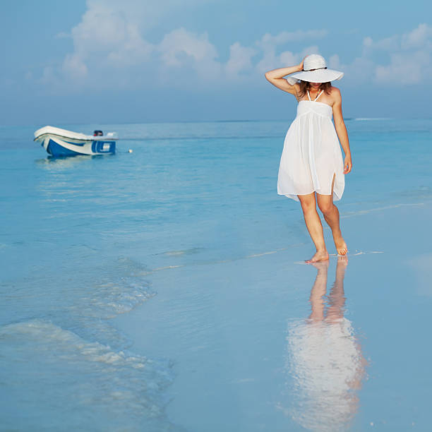 istock Caucasian woman practicing yoga at seashore 489035960