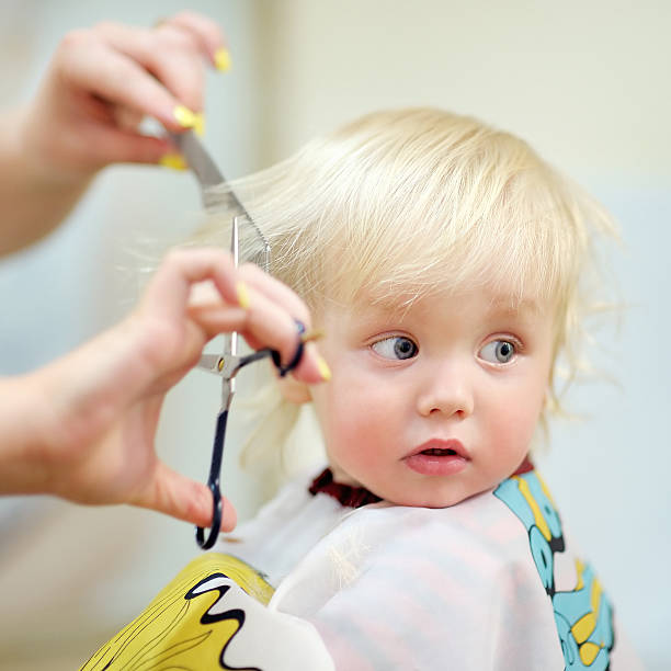 istock Toddler child getting his first haircut 489036136