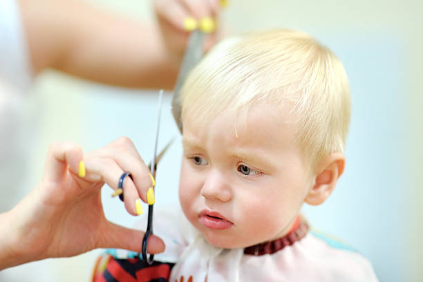 istock Toddler getting his first haircut 489036220