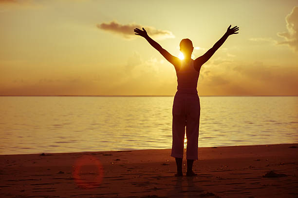 istock Caucasian woman practicing yoga at seashore 489038744